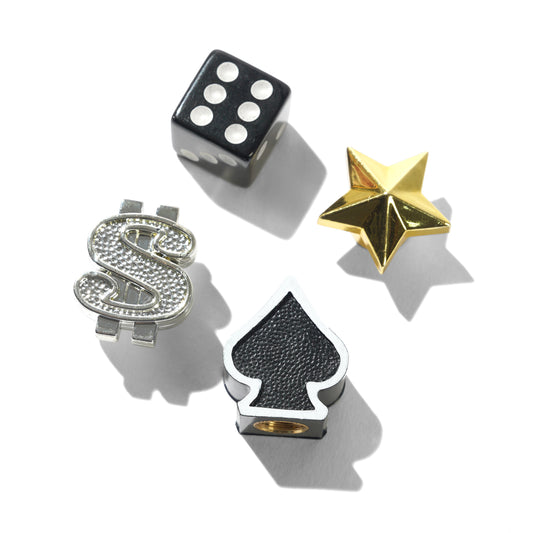 Decorative valve caps including a dice, letter 'S', star-shaped object, and spade symbol on a white background