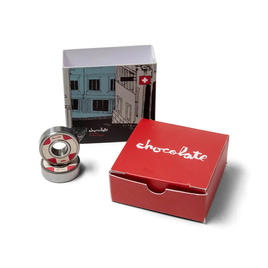 Two skateboard bearings and a red box with 'chocolate' branding on a white background.