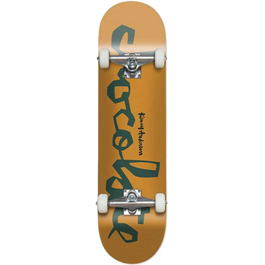 Skateboard with a brown deck and green logo on a white background