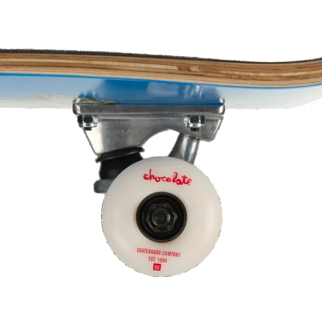 Close-up of a skateboard wheel and truck, showing a white translucent wheel with red 'chocolate' branding and a light blue underside of the deck, on a white background.