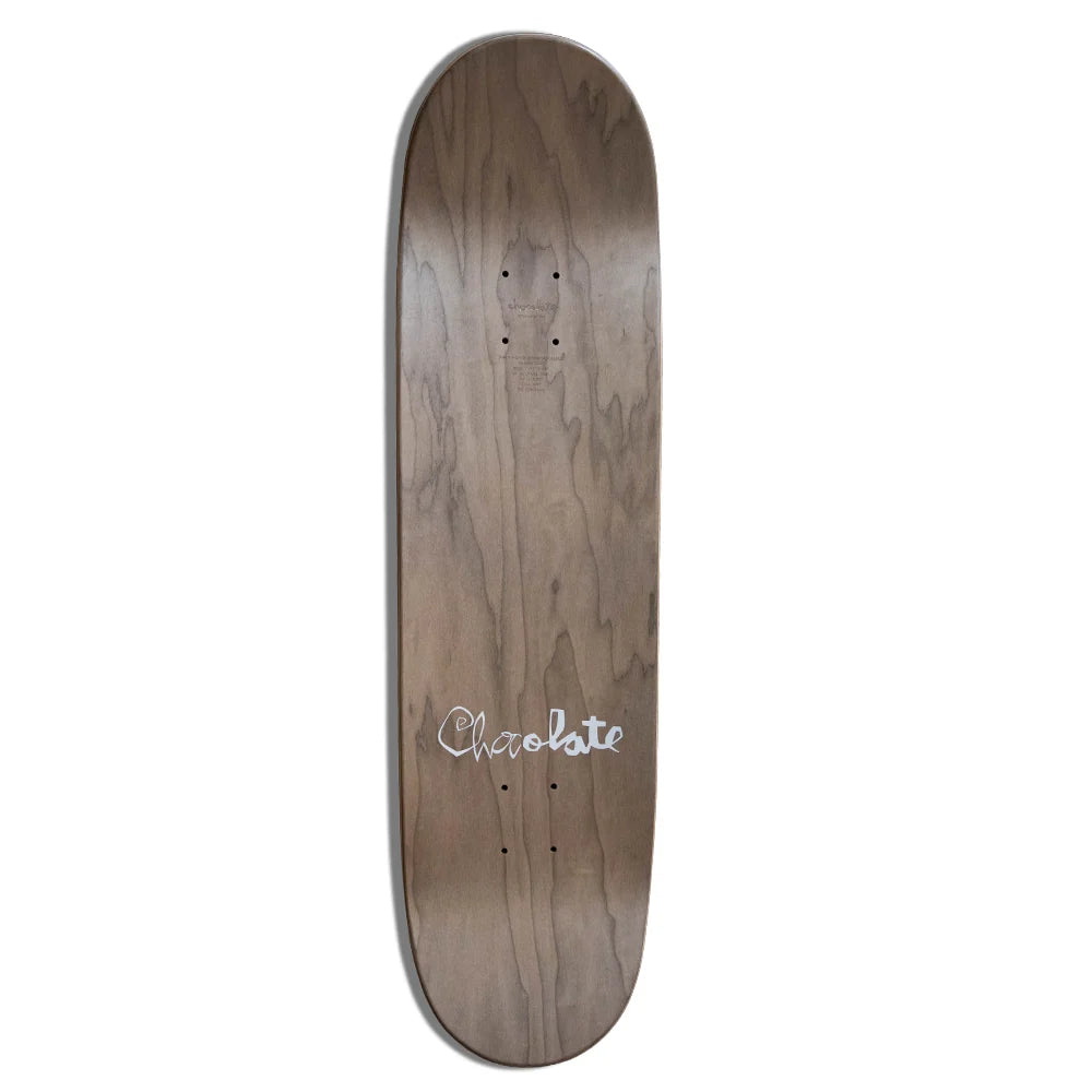 A wooden skateboard deck shown vertically against a plain white background, featuring a medium brown wood grain finish with a white script logo reading 'Chocolate' near the bottom.