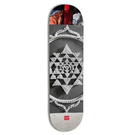 Skateboard deck with geometric pattern on a white background