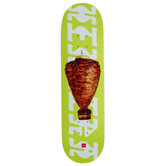 Skateboard deck with a green background and a large piece of meat on top