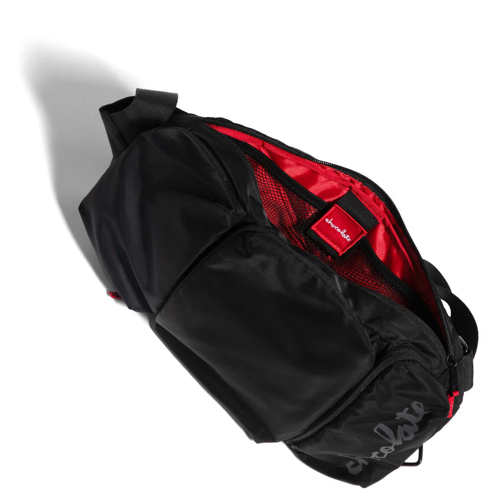 Black and red backpack with visible brand logo on a white background
