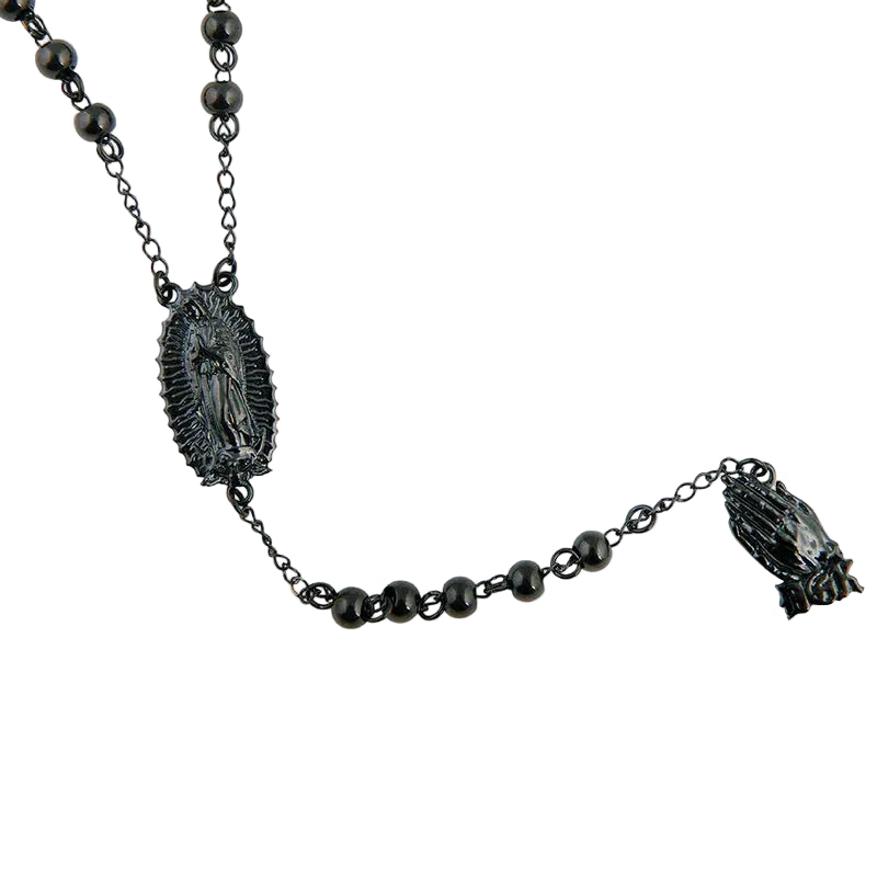 Black beaded necklace with religious pendant on a white background