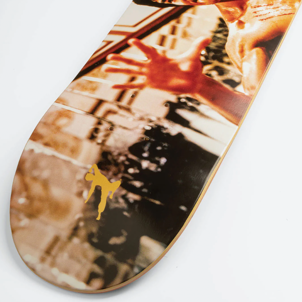 Skateboard deck with a graphic design of a person and a hand on a white background