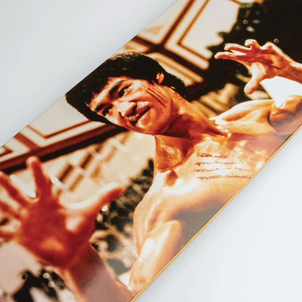 Poster of a muscular man in a dynamic pose with another person in the background.