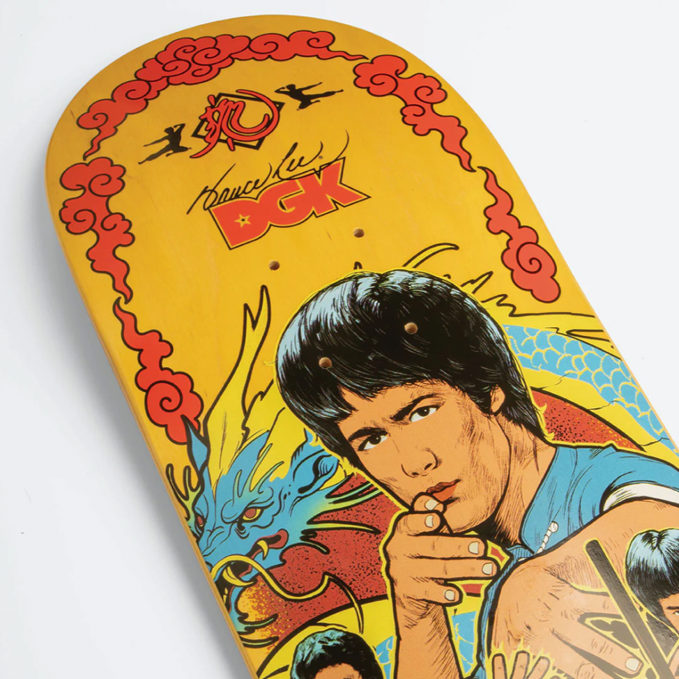 Skateboard deck with a colorful design featuring a person and text on a white background