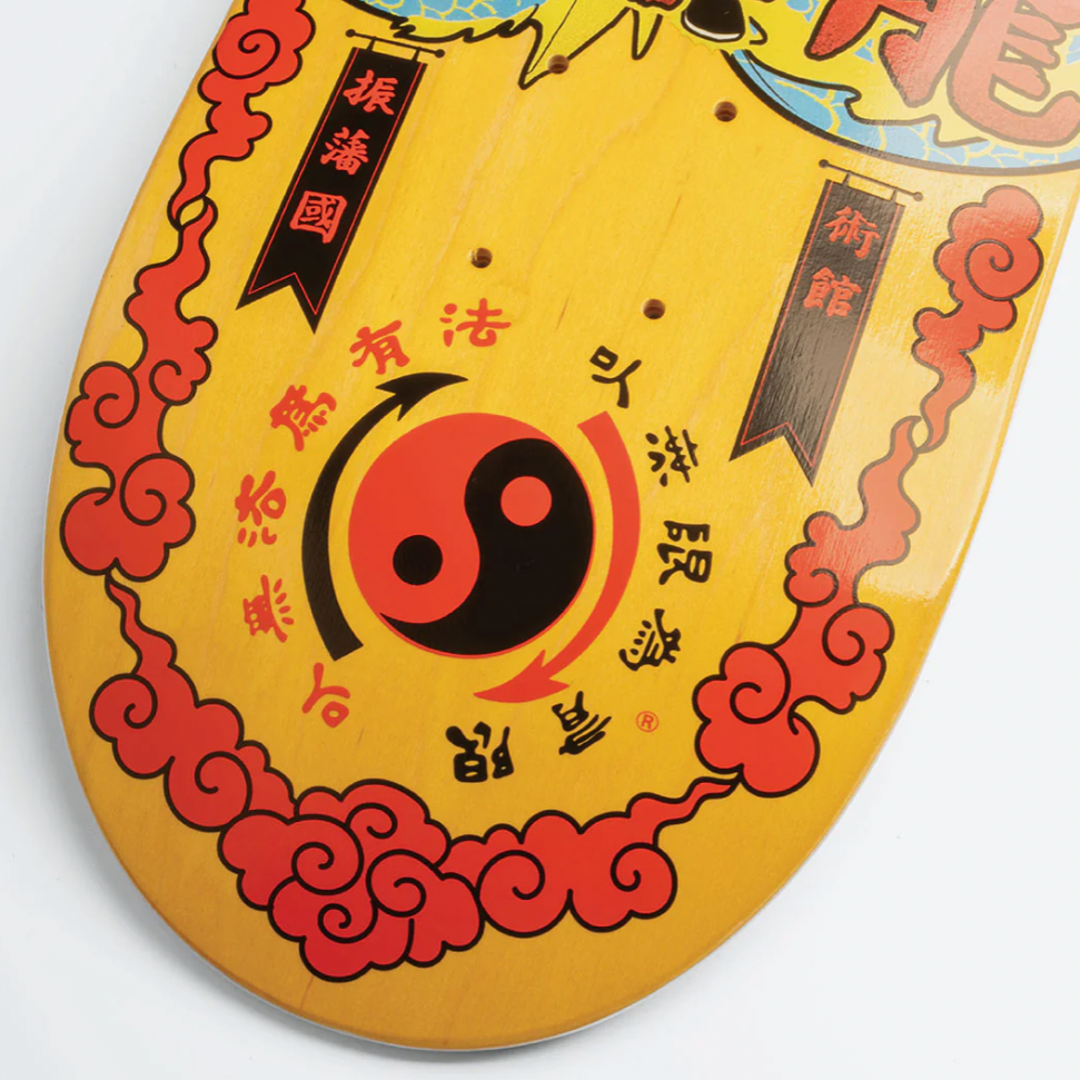 Decorative item with Chinese characters and a yin-yang symbol on a yellow background