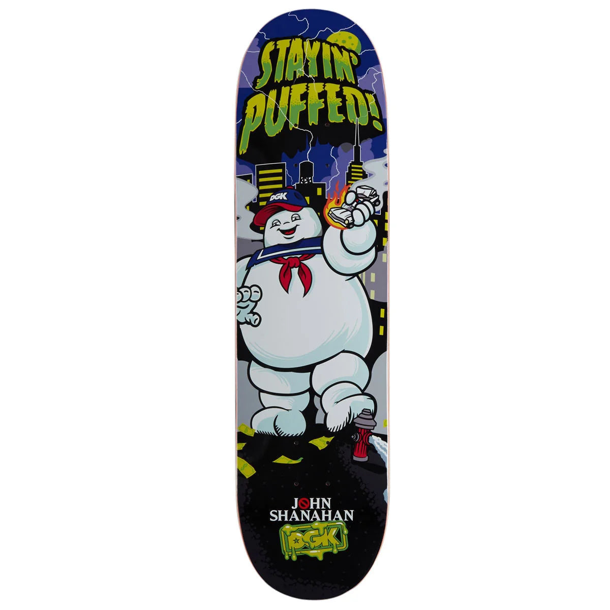 A Ghostbusters skateboard deck featuring the Stay Puft character and the text 'STAYING PUFFED!' and 'JOHN SHANAHAN ROCKS!' on a white background.