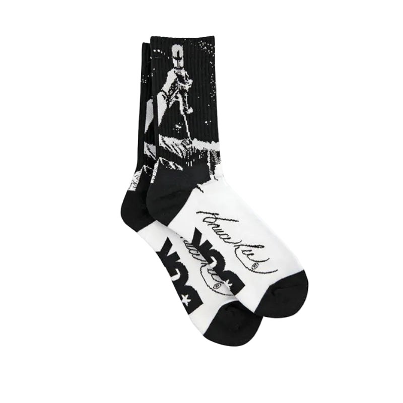 Black and white socks with graphic designs on a white background