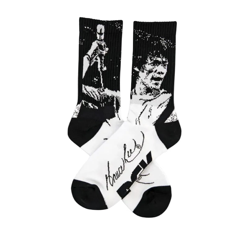Socks with a graphic design of a famous martial artist on a white background