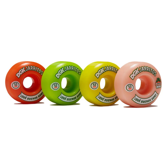 Four dgk/Jarritos skateboard wheels in orange, green, yellow, and pink, arranged in a row on a white background.