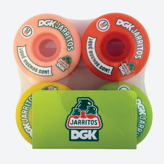 Four DGK Jarritos skateboard wheels in assorted colors (peach, orange, yellow, and green) packaged in a clear plastic sleeve with a bright green cardboard insert featuring the DGK Jarritos logo.