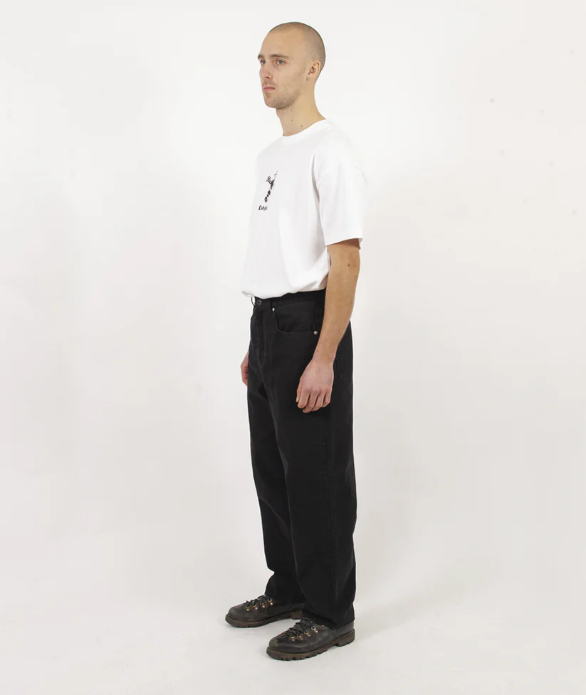 Man wearing a white t-shirt and black pants on a white background
