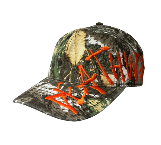 Camouflage baseball cap with orange text on a white background