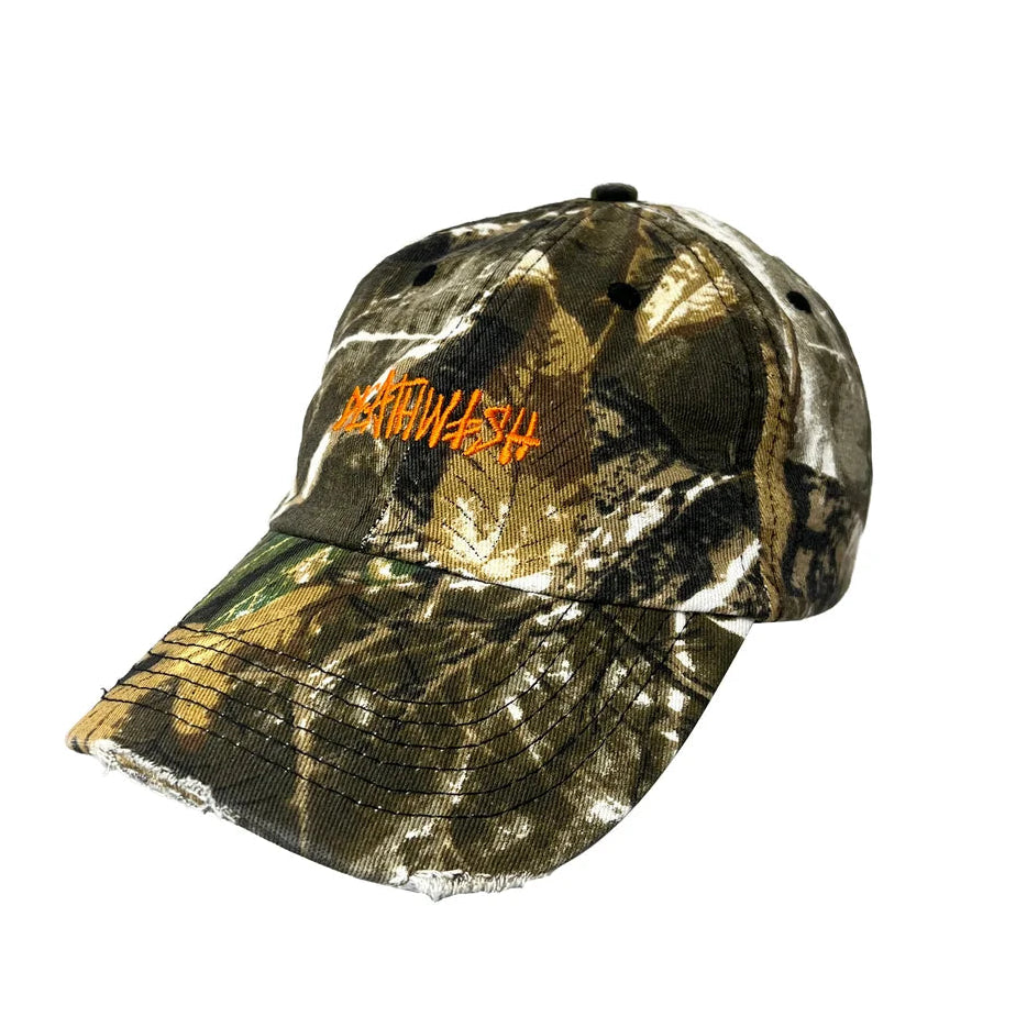 A camouflage baseball cap with an orange embroidered logo reading 'DEATHWASH' on the front, shown against a plain white background.