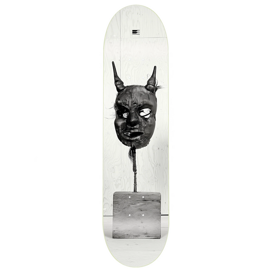 Skateboard deck with a black and white graphic of a mask on a white background