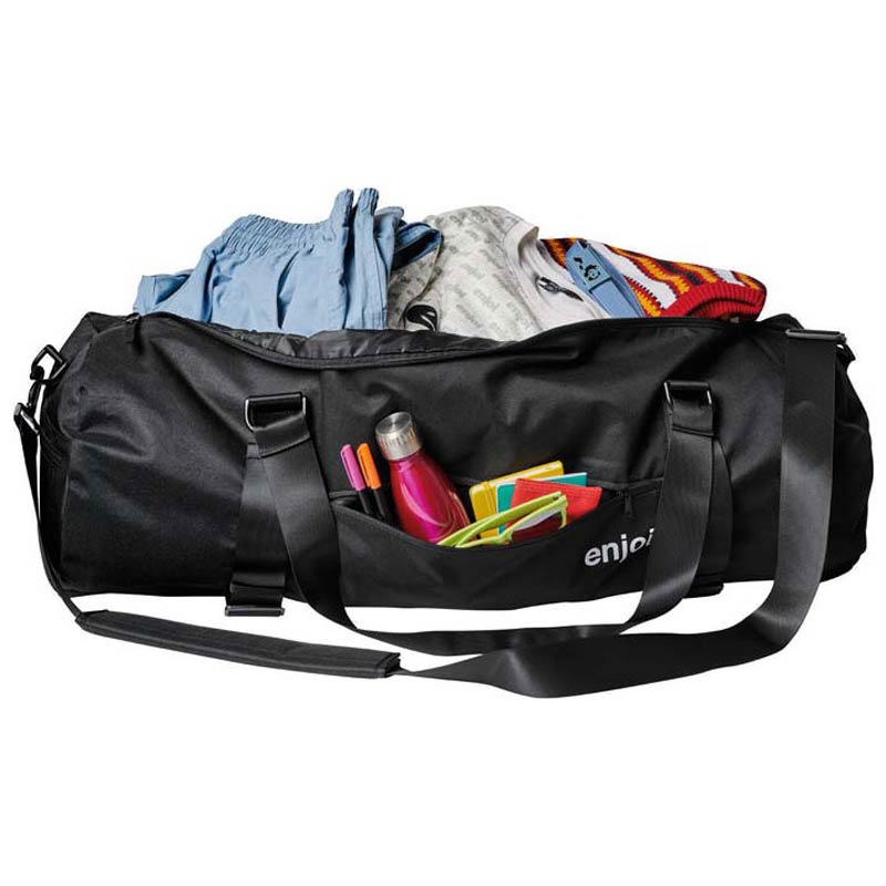 A black duffel bag filled with clothes and colorful accessories, shown on a plain white background. The bag has a front pocket with pens and notebooks, and the brand name 'enjoy' is partially visible on the front.