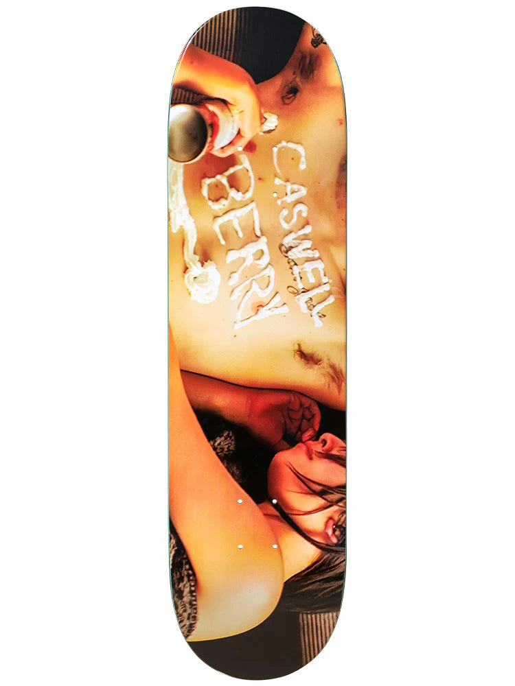 Skateboard deck with a graphic design featuring a woman's face and the brand name 'Caswell'.