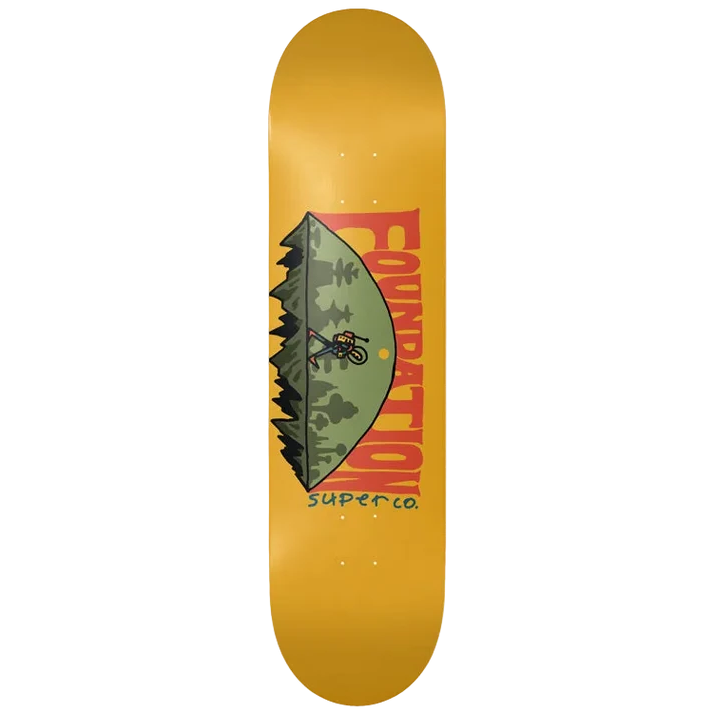 A skateboard deck featuring a mustard yellow background with a central graphic of a person carrying a guitar over a green hill, under large red 'FOUNDATION' lettering and vertical 'Super Co' text.