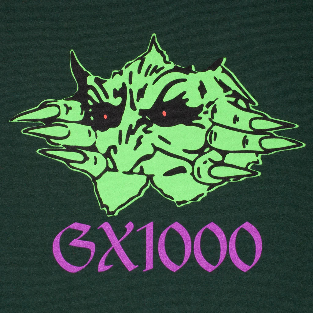 Green alien-like creature with red eyes and 'GX1000' text on a dark green background