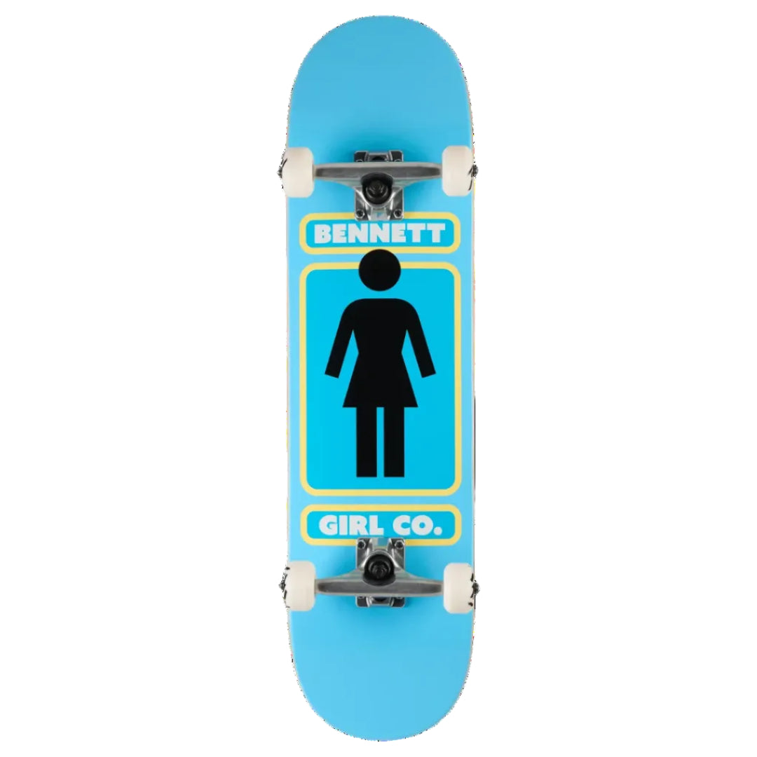 A skateboard deck with a bright blue background, featuring a black female silhouette icon in the center, bordered by yellow lines, with 'BENNETT' at the top and 'GIRL CO.' at the bottom.