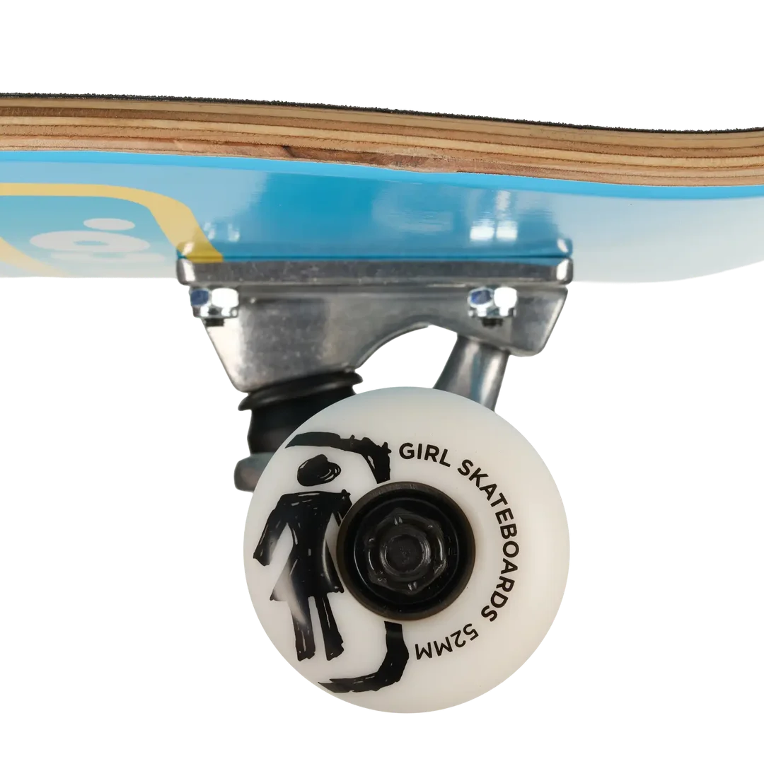Close-up of a skateboard wheel and truck assembly on a light wood deck with a blue graphic background. The wheel is white with black text reading 'GIRL SKATEBOARDS 52MM' and a black stick-figure graphic.