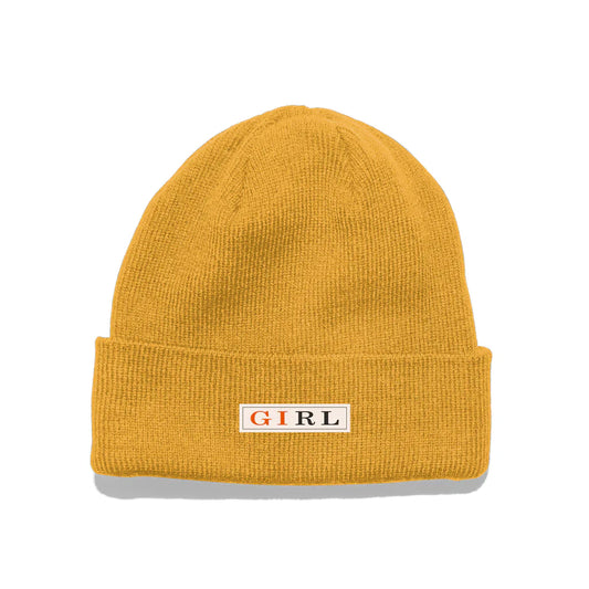 Yellow beanie with 'GIRL' logo on a white background