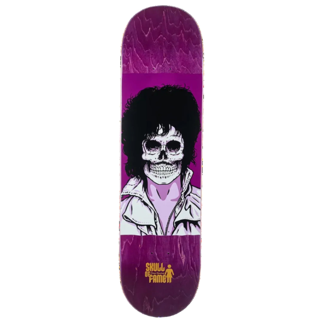 A skateboard deck with a purple and magenta woodgrain finish, featuring a graphic of a skull wearing a white jacket with black hair, and the yellow 'Skull of fame' logo near the bottom.