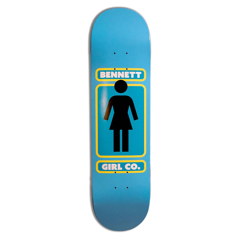 A skateboard deck with a blue gradient background and a central graphic featuring a black female silhouette inside a yellow-bordered box, with the text 'BENNETT' above and 'GIRL CO.' below.