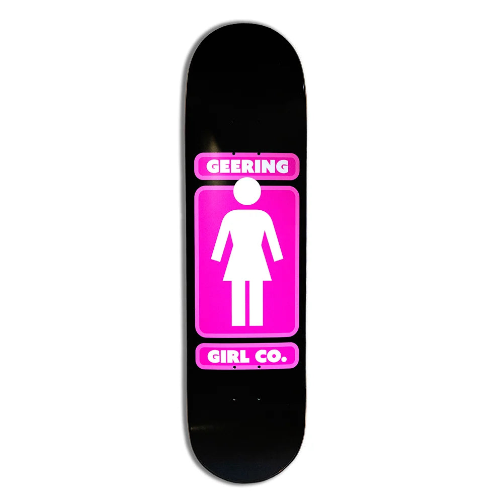 A black skateboard deck featuring a bold graphic design with a pink restroom sign icon and the text 'GEERING' at the top and 'GIRL CO.' at the bottom.