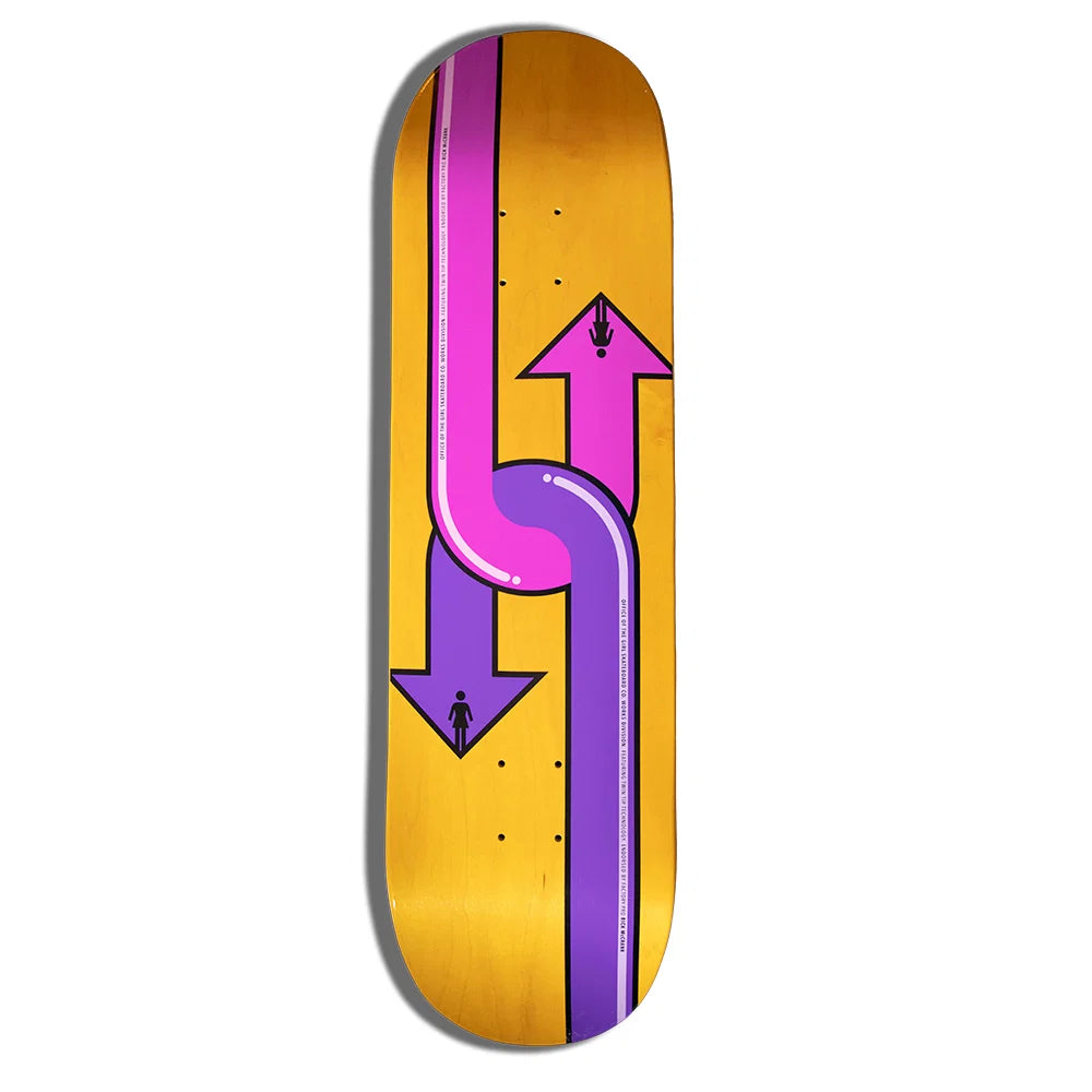 A skateboard deck featuring a graphic design of two intersecting arrows, one purple and one pink, on a metallic gold background.