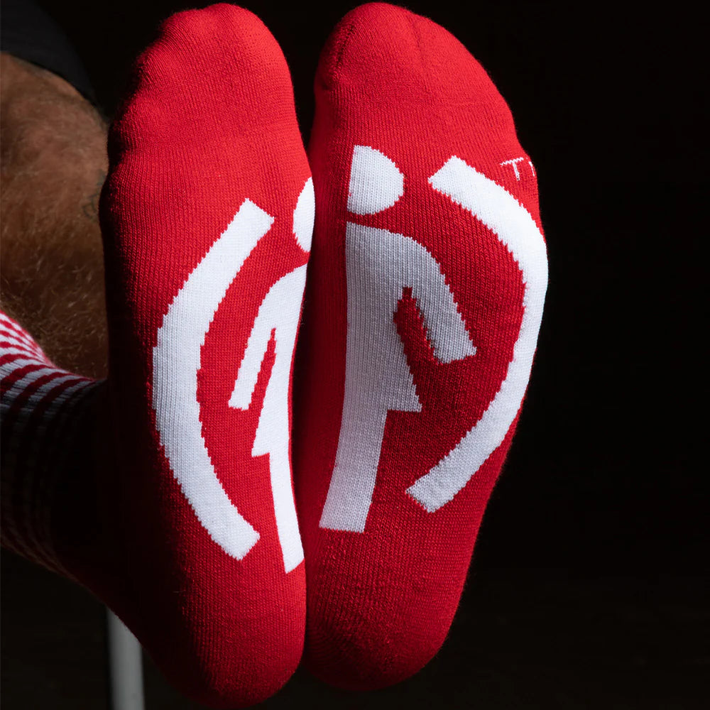 Red socks with white symbols on a black background