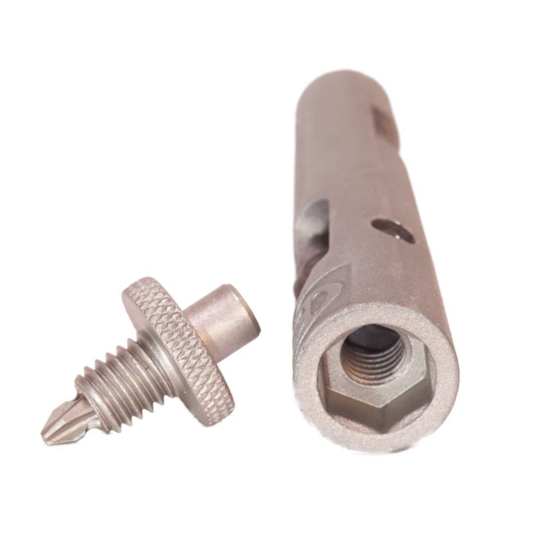 Metal screw and cylindrical component on a white background