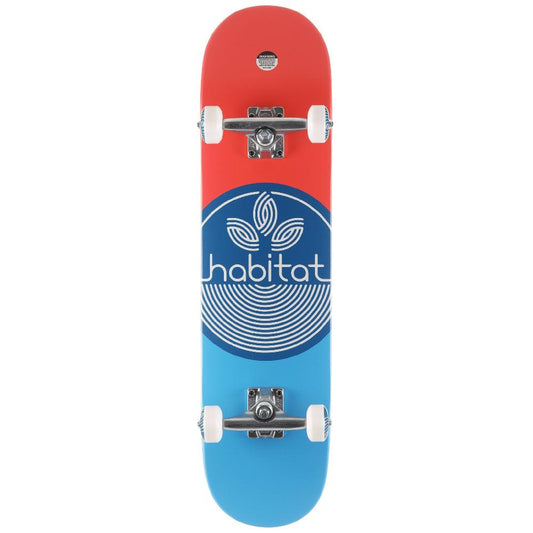 Skateboard with red and blue design and 'habitat' logo on a white background