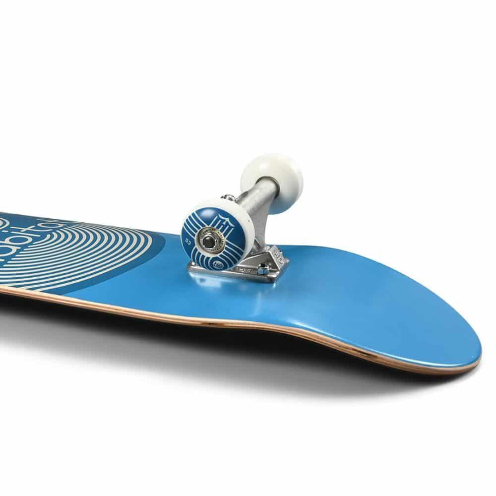Blue skateboard with white wheels on a white background