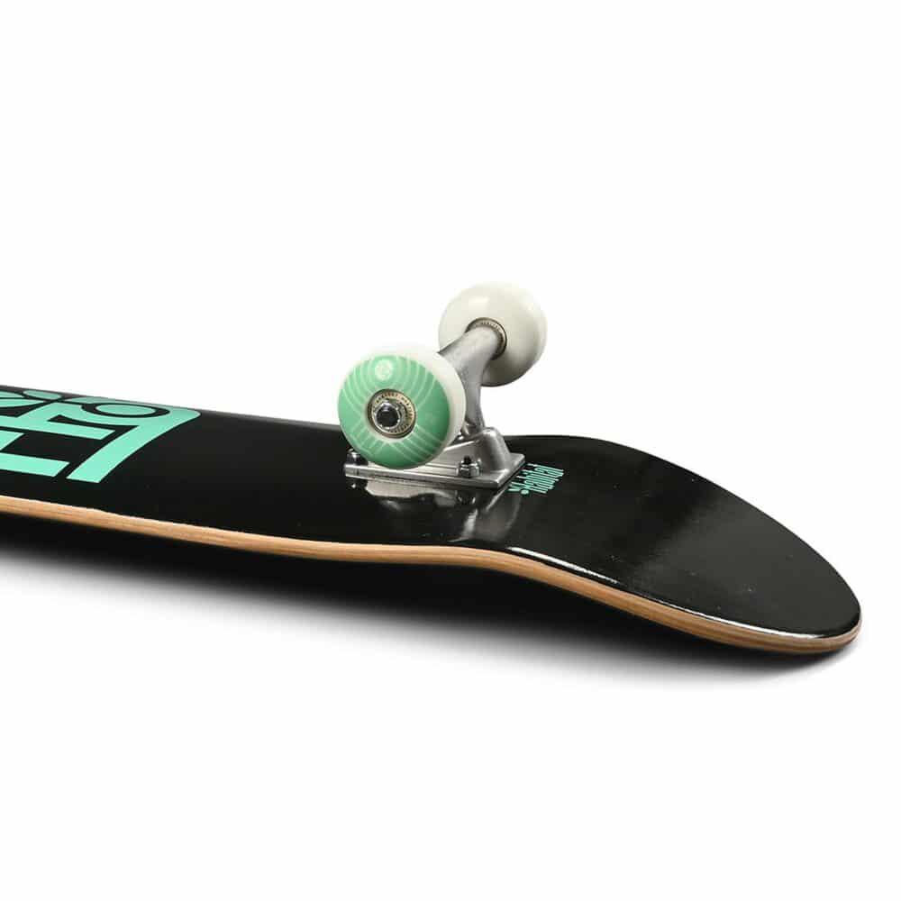 Skateboard with a black deck, green logo, and white trucks on a white background