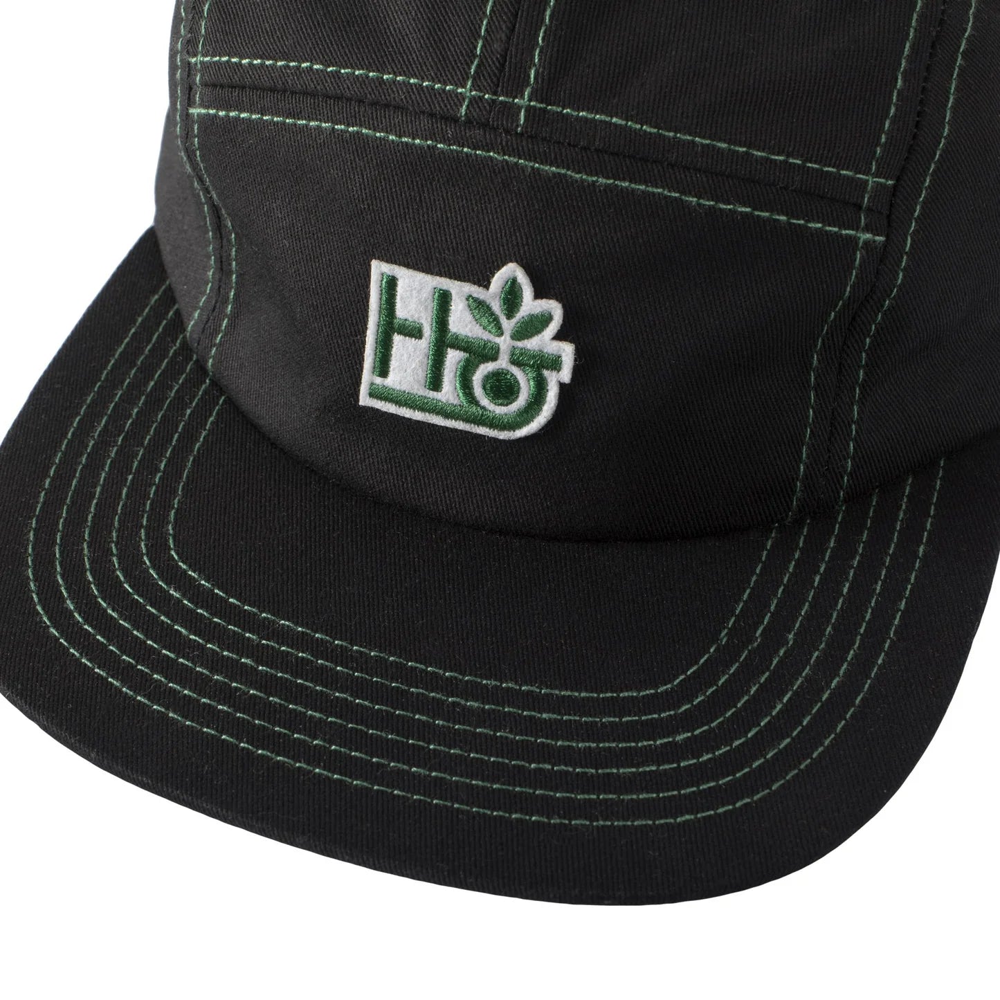 Black cap with a green and white logo on a white background