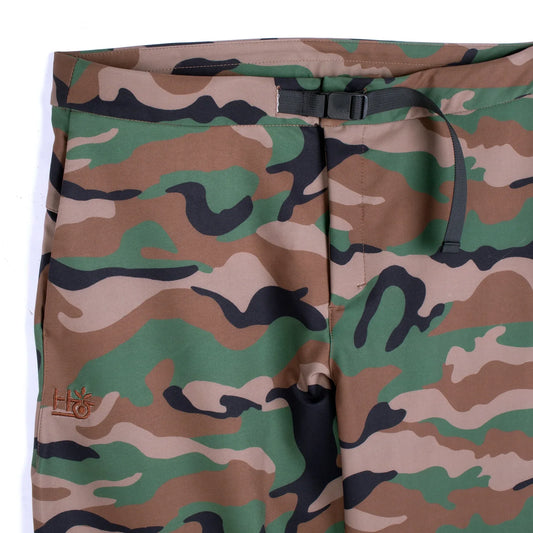 Camouflage-patterned pants with a visible brand logo on a white background
