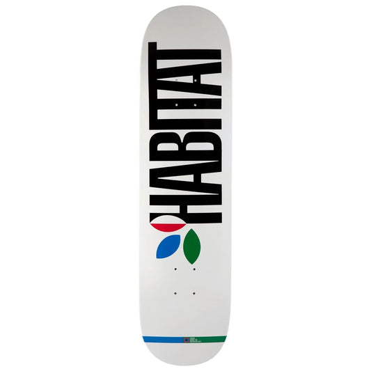 A white skateboard deck featuring the word 'HABITAT' printed vertically in bold black letters, with a small multicolor logo graphic and a blue and green stripe near the bottom.