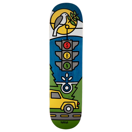 A skateboard deck featuring a colorful graphic design with a bird on a tree, a traffic light, a yellow car, and green trees on a white background.