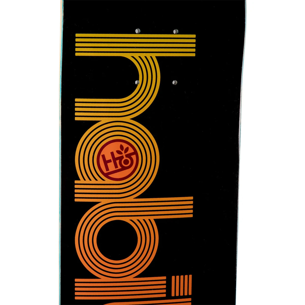 A close-up of a skateboard deck featuring a bold graphic design with concentric orange and yellow stripes forming stylized letters on a black background