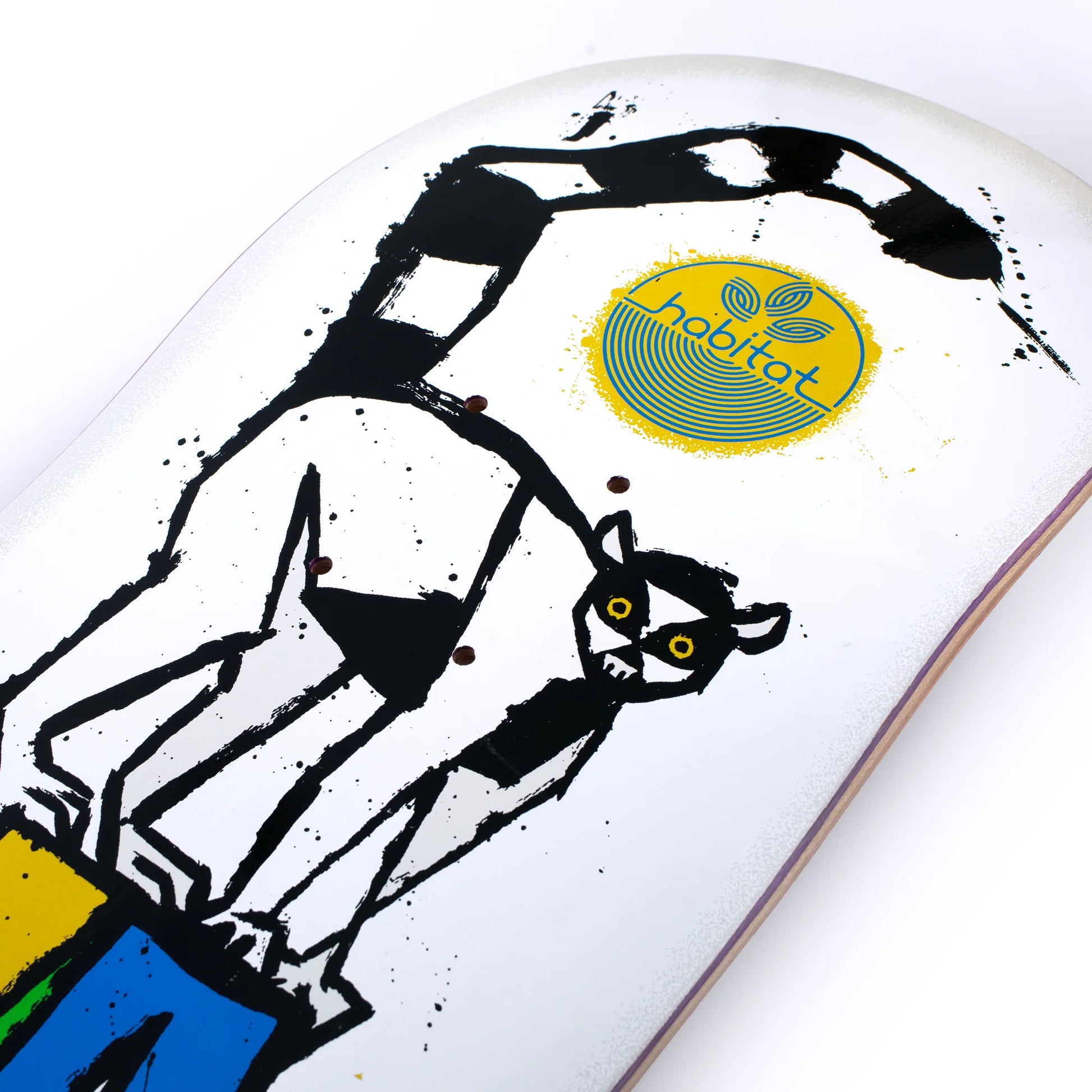 Skateboard deck with a lemur illustration and Habittat logo on a white background