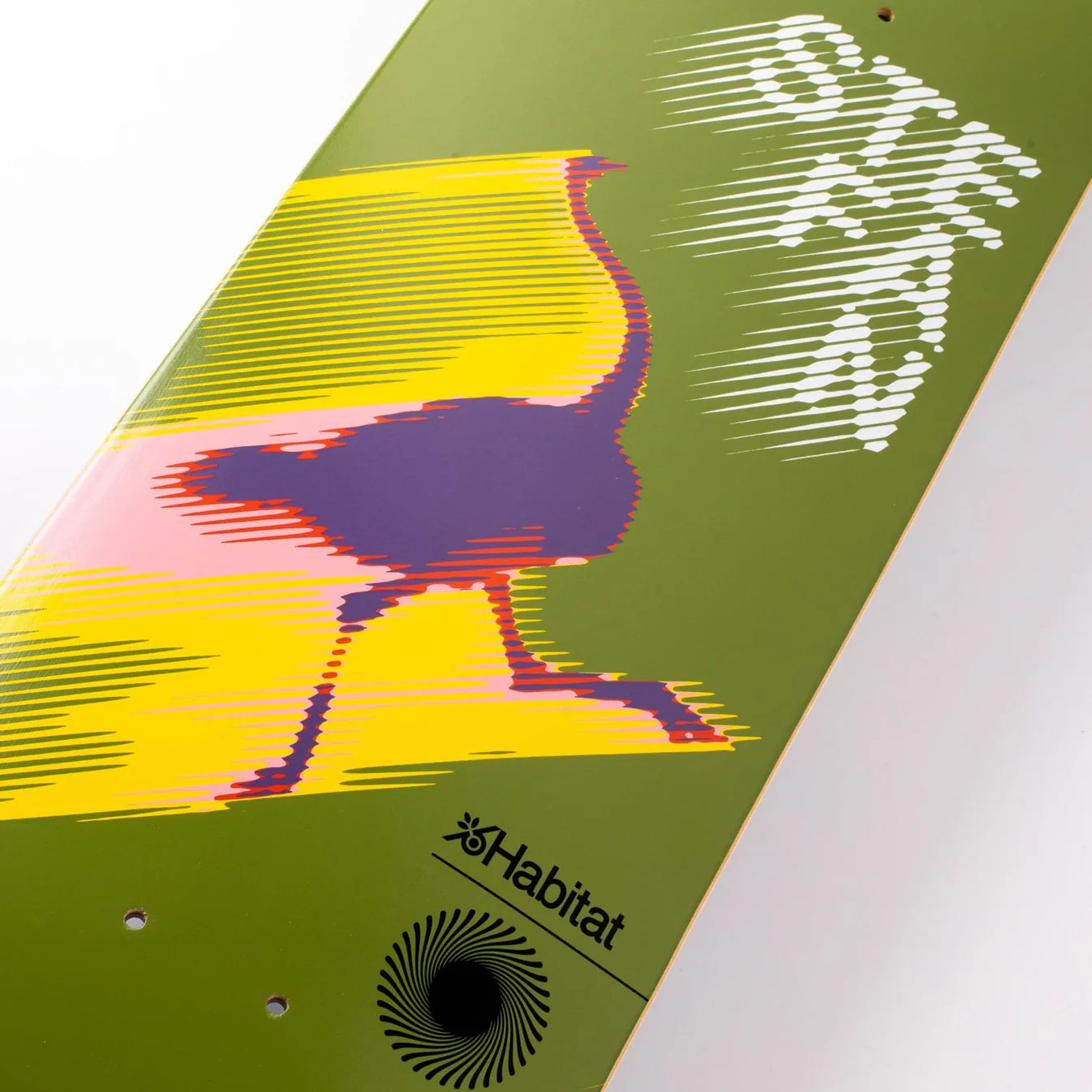 Skateboard deck with colorful bird design and 'Habitat' branding on a green background