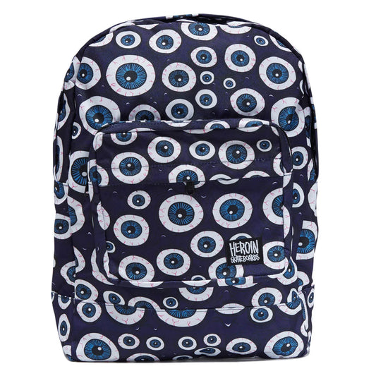 A navy blue backpack with an all-over white and blue eye print, featuring a front zip pocket and a black and white HERON brand patch.