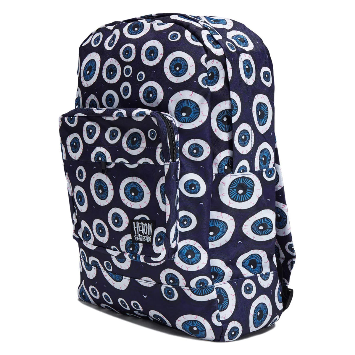 A navy blue backpack with a repeating all-over eye print in white, blue, and black, featuring a front zip pocket and a visible 'THE BODY SHOP' logo patch.