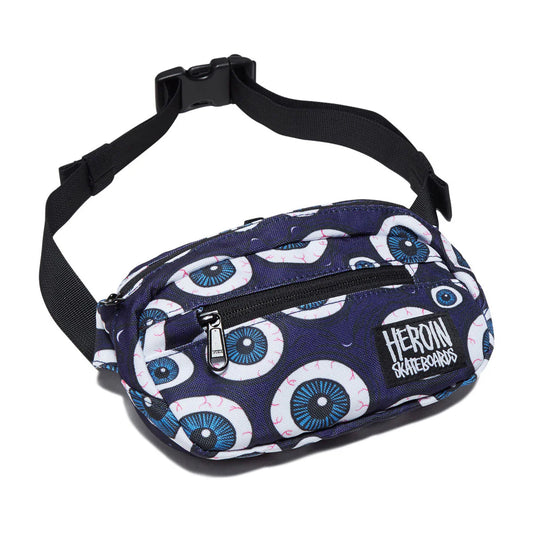 A Heron Skateboards fanny pack featuring a navy blue base with a white and blue eyeball pattern, a black adjustable strap, and a front zippered pocket.