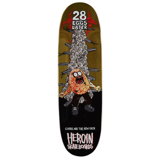 A skateboard deck featuring a graphic design with the text '28 EGGS LATER' at the top and 'HEROIN SKATEBOARDS' at the bottom. The graphic shows a cartoon character made of eggs being attacked by a chainsaw, with a dark olive-green background and a black lower section.