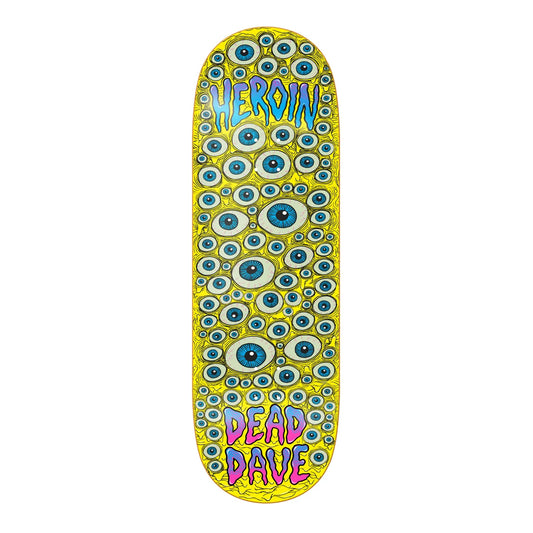 A skateboard deck featuring a vibrant yellow background covered in a dense pattern of blue and white eyeballs. The top has the word 'HEROIN' in blue and purple, and the bottom has 'DEAD DAVE' in pink and purple, all on a plain white background.